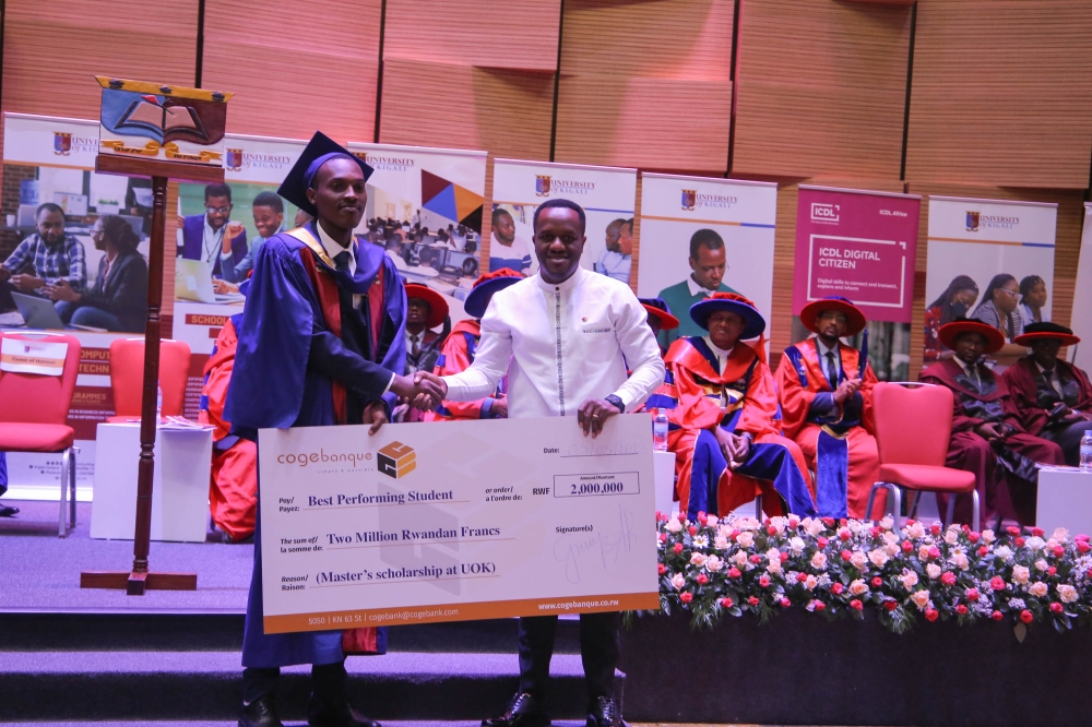 Antoine Iyamuremye, Head of Marketing and Product Development at Cogebanque awarded the best-performing graduates of the University of Kigali during the graduation ceremony of over 1,800 graduates on March 3. Dan Gatsinzi