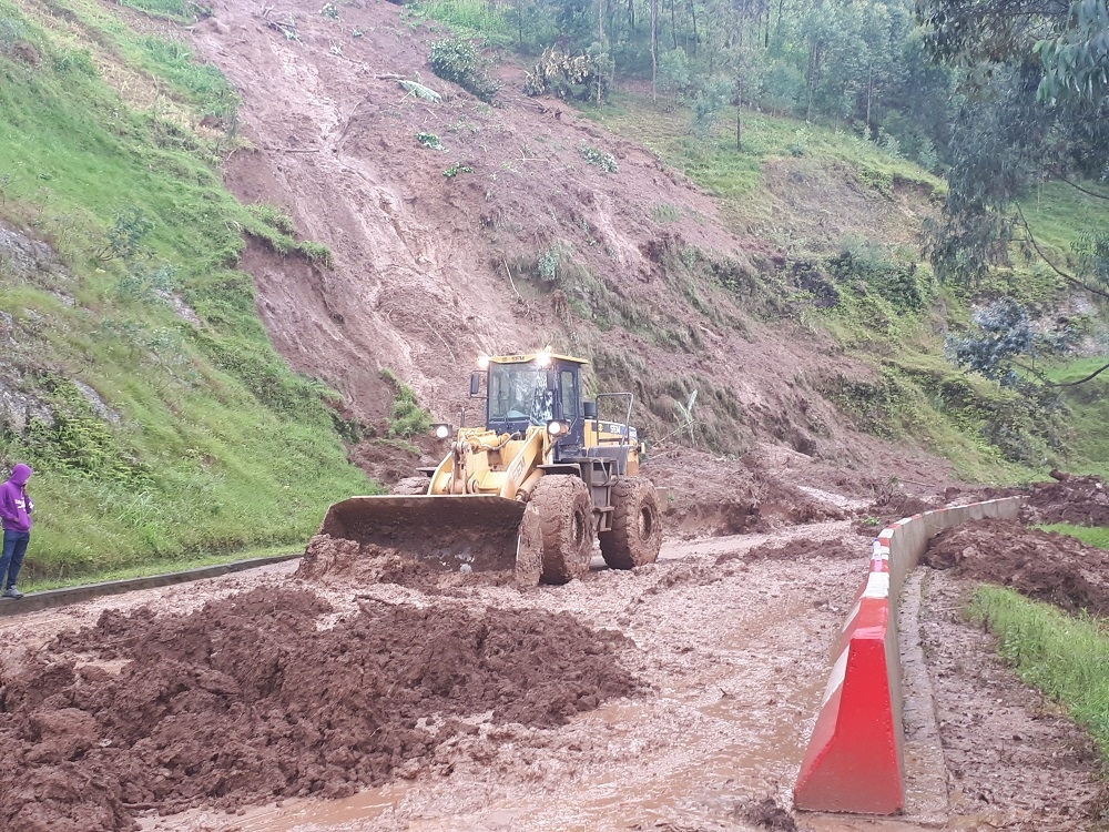 Workers remove landslides that blocked a road at Buranga in Gakenke District on April 17, 2022. Due to heavy rains that sometimes cause landslides in Musanze-Kigali road ,the government is building a 32 kilometres road that could be used in case of a landslide emergency. FILE
