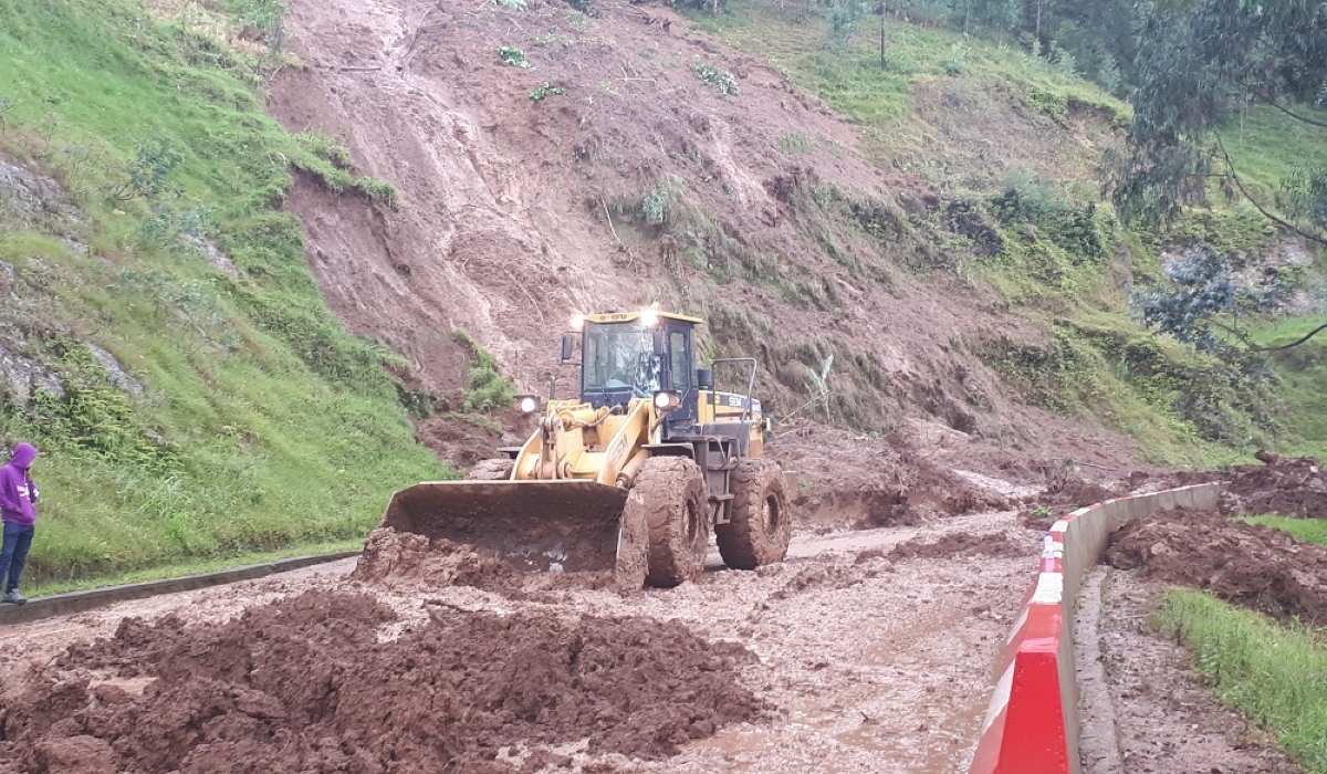 Workers remove landslides that blocked a road at Buranga in Gakenke District on April 17, 2022. Due to heavy rains that sometimes cause landslides in Musanze-Kigali road ,the government is building a 32 kilometres road that could be used in case of a landslide emergency. FILE