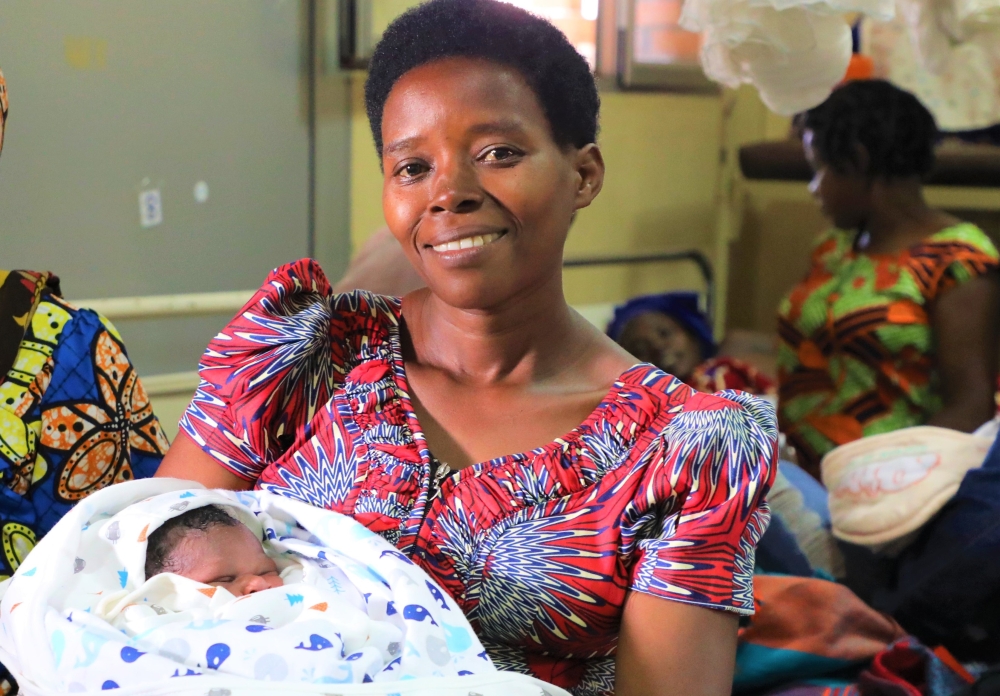 A woman with her newborn at Kacyiru Hospital on January 1. Craish Bahizi