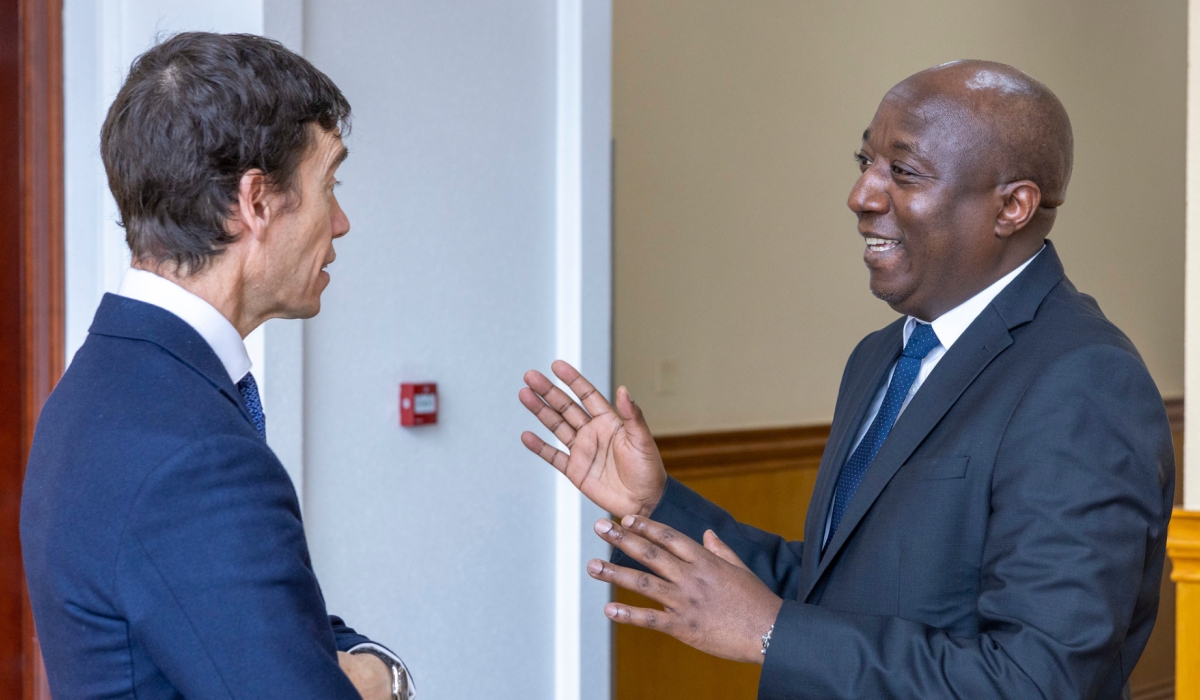 Prime Minister Edouard Ngirente interacts with Rory Stewart, President of GiveDirectly after a meeting in Kigali on Thursday, March 9. Courtesy