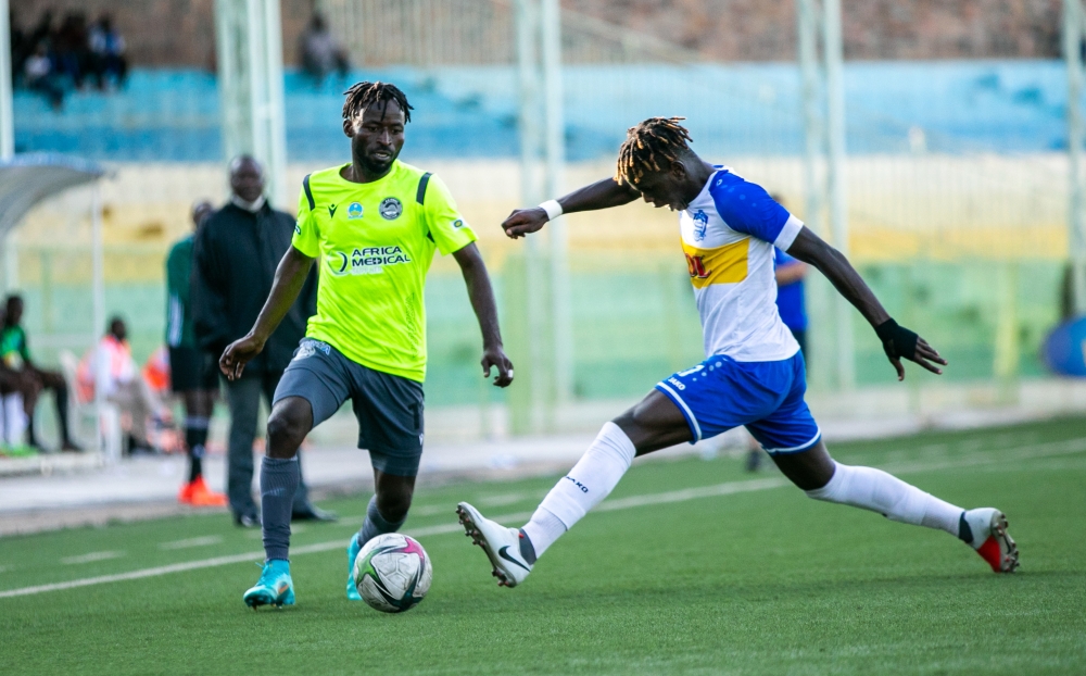AS Kigali striker Hussein Shabalala tries to dribble past Rayon Sports defender during a past match. Rayon Sports will face rivals AS Kigali on Sunday, March 12, at the  Bugesra stadium. Olivier  Mugwi