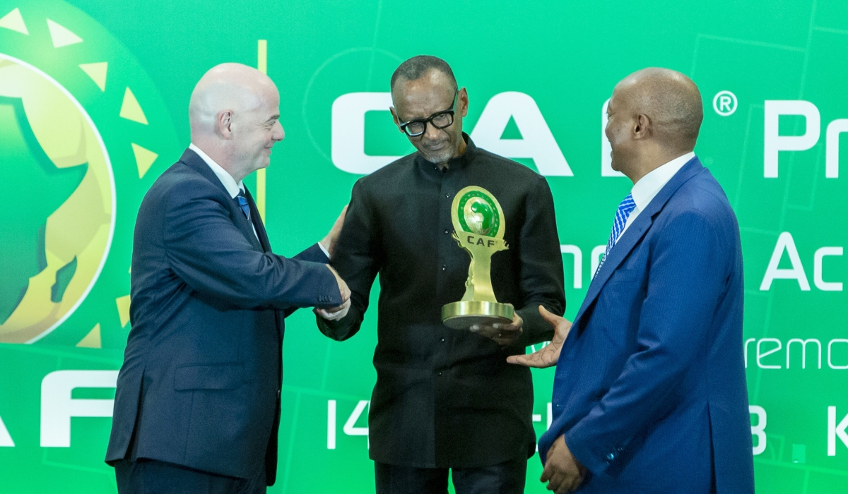 President Kagame receives the CAF President’s Outstanding Achievement Award 2022 from the President of the Confederation of African Football, Patrice Motsepe, and FIFA President Gianni Infantino in Kigali, on Tuesday, March 14. Photos by Olivier Mugwiza