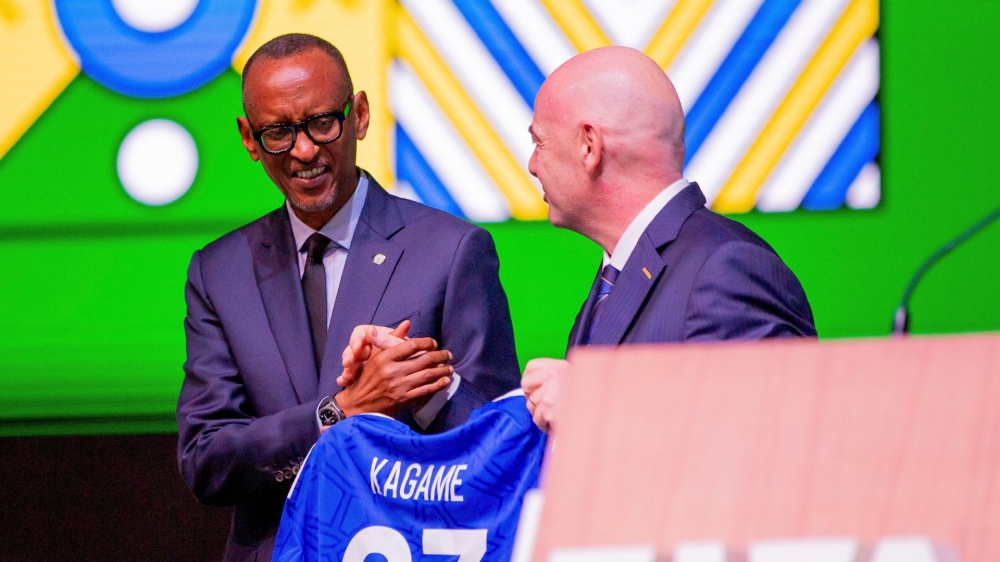 FIFA President Gianni Infantino hands over the award to President Paul Kagame receives the award during FIFA Congress in Kigali on March 16. Olivier Mugwiza