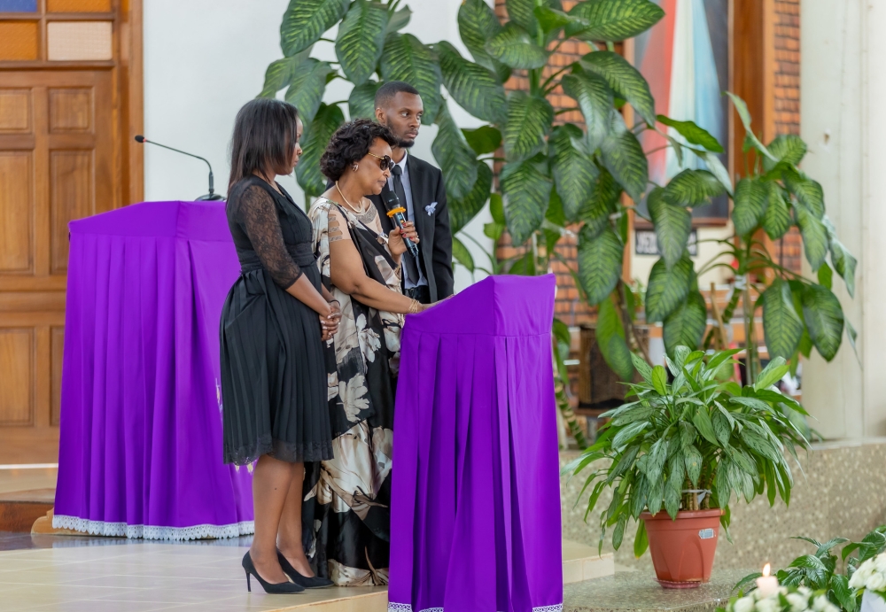 Irene Mukanaho, the widow of Gen Gatsinzi who she fondly only referred to as Marcel, eulogises her late husband during a requiem mass at Regina Pacis church in Remera, on Thursday, March 16. She’s flanked by two of their children. Courtesy photos