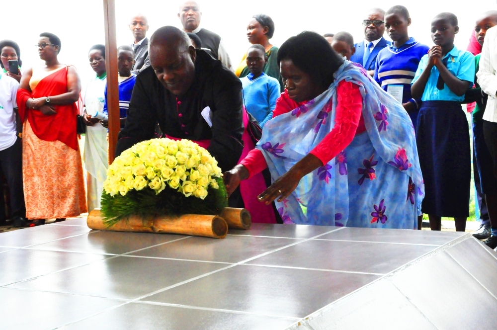 Mourners lay a wreath to pay tribute to Nyange heroes during a commemoration event on Saturday, March 18. Courtesy
