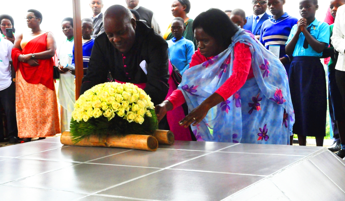 Mourners lay a wreath to pay tribute to Nyange heroes during a commemoration event on Saturday, March 18. Courtesy