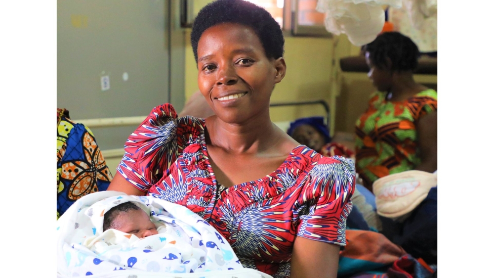 A woman with her newborn at Kacyiru Hospital on January 1. MPs have proposed that paternity leave be increased from the current four days to 30 days. Craish Bahizi