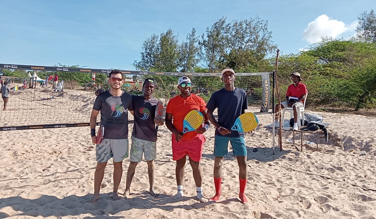 Beach tennis duo Valens Habimana and Joshua Muhire in a photo with their opponents after the game. Courtesy