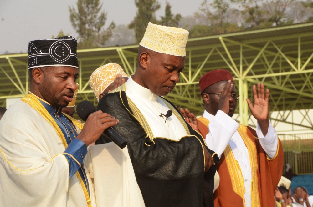 The Mufti of Rwanda Sheikh Salim Hitimana (c) during Eid prayer at Kigali stadium. Sheikh  Hitimana has urged Muslims to use the holy month of Ramadan to reflect Islamic values and also pray for their families and the country.