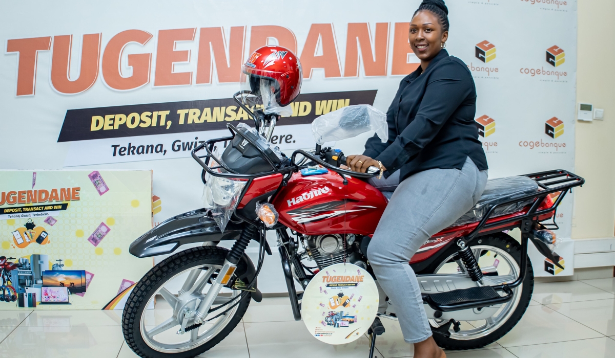 The winner of a motocycle during Tugendane na Cogebanque 2023 awarding event in Kigali on March 21. Photos by Dan Gatsinzi