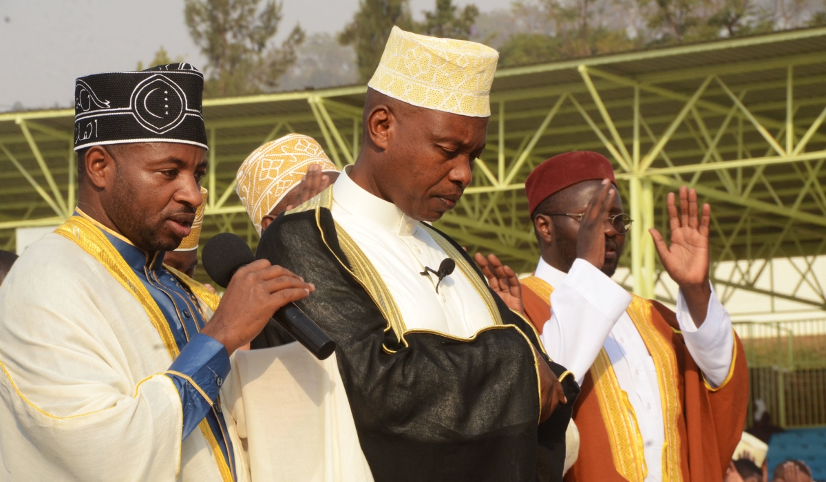The Mufti of Rwanda Sheikh Salim Hitimana (c) during Eid prayer at Kigali stadium. Sheikh  Hitimana has urged Muslims to use the holy month of Ramadan to reflect Islamic values and also pray for their families and the country.
