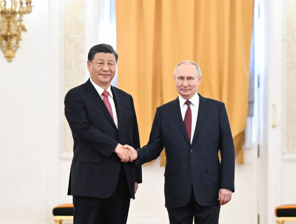 Chinese President Xi Jinping shakes hands with Russian President Vladimir Putin at the Kremlin in Moscow, Russia, March 21, 2023. Xi on Tuesday held talks with Putin in Moscow. Putin held a solemn welcome ceremony for Xi Jinping at the St. George&#039;s Hall. (Xinhua/Xie Huanchi)