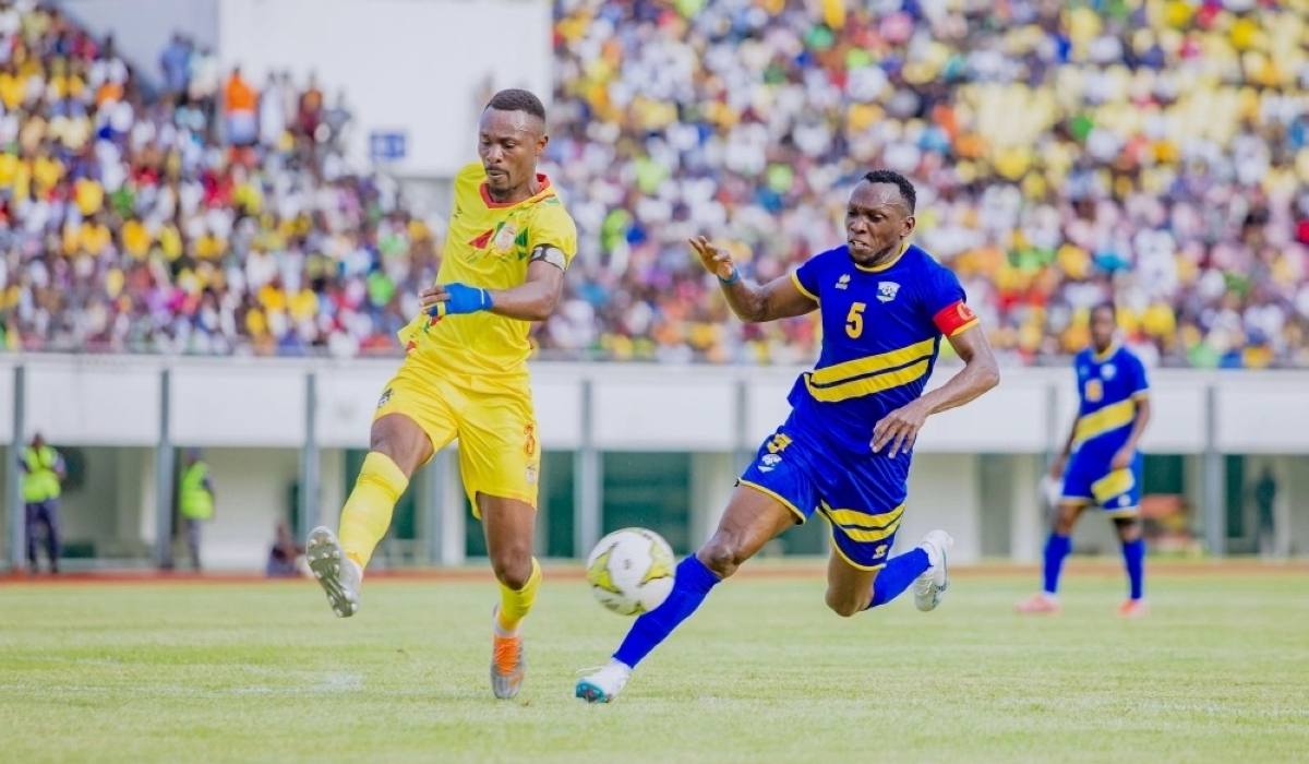 Team captain Meddie Kagere tries go past Benin&#039;s defender during the game.