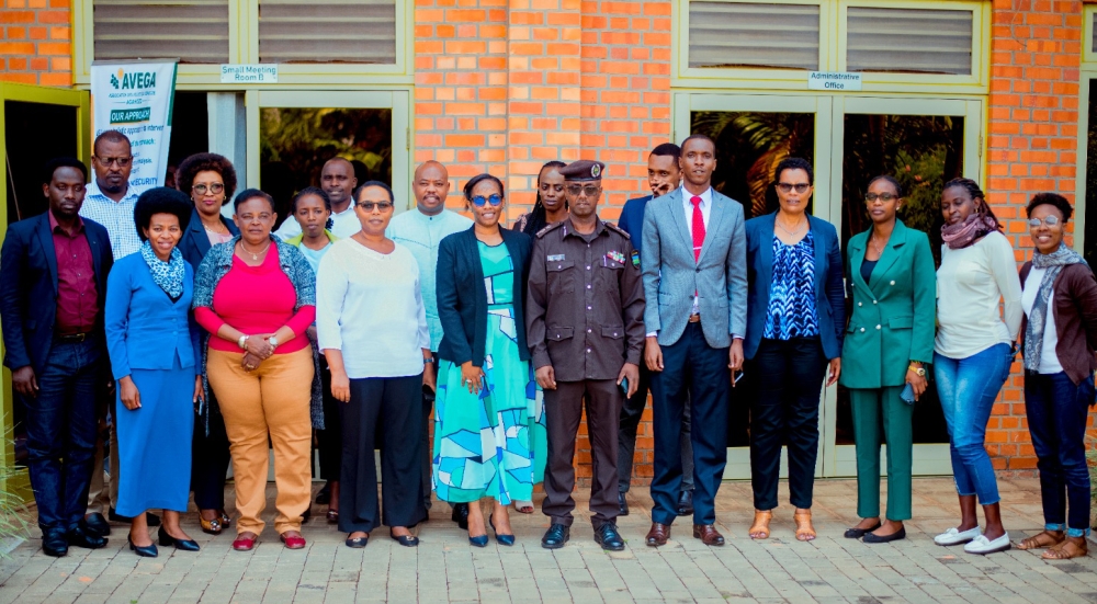 Participants in  a policy dialogue organised by the Association of Genocide Widows Agahozo (AVEGA) pose for a photo after a session in Kigali on March 22. Courtesy