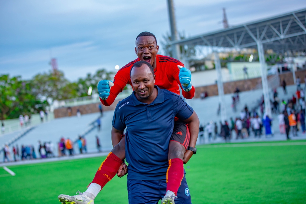 Police FC head coach Vincent Mashami celebrates the victory with his goalkeeper after beating Burundi. Courtesy