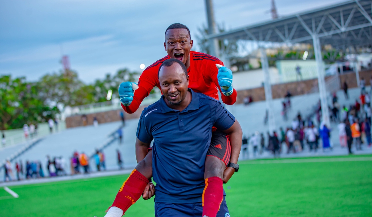Police FC head coach Vincent Mashami celebrates the victory with his goalkeeper after beating Burundi. Courtesy