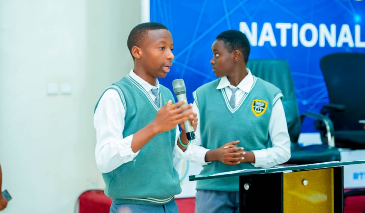 Emile Keza, a Senior five student at New Life Ministries Academy with his colleague presenting the project.