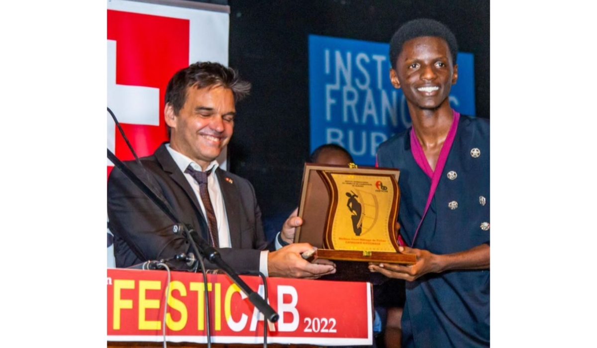 Lionel Nishimwe (Right) receiving an award at FESTICAB 2022. Courtesy photos