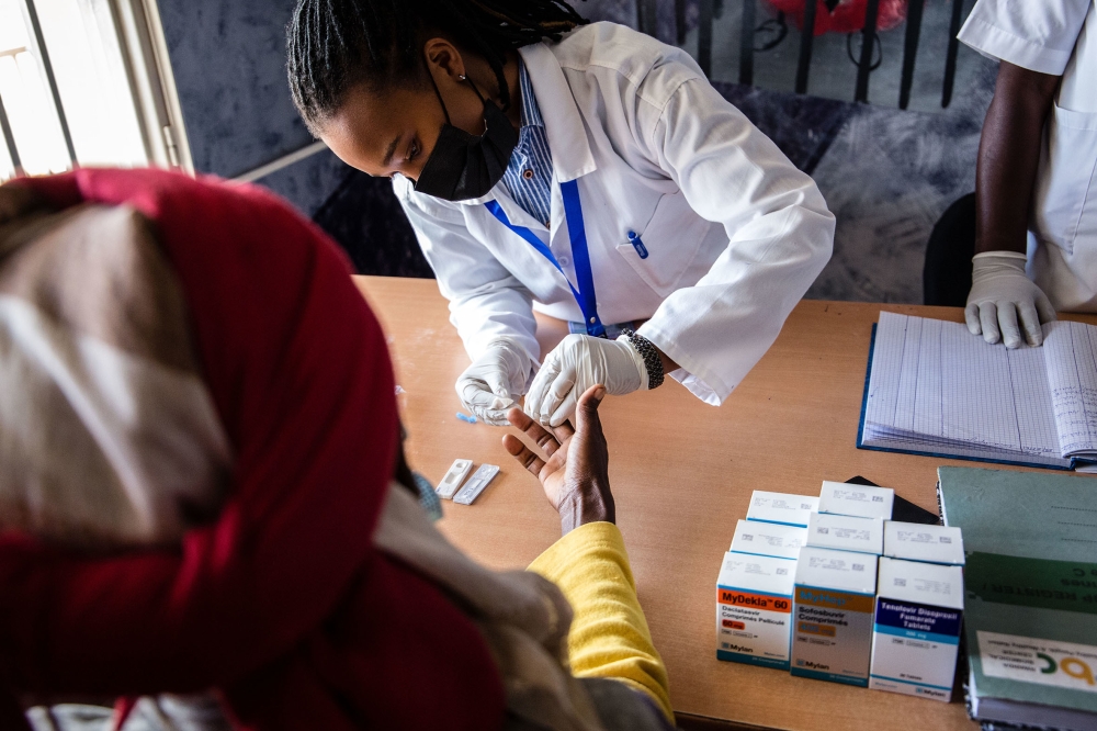 Health workers conduct  Hepatitis test during the celebration of the World Hepatitis Day at Remera health center on July 28, 2021 