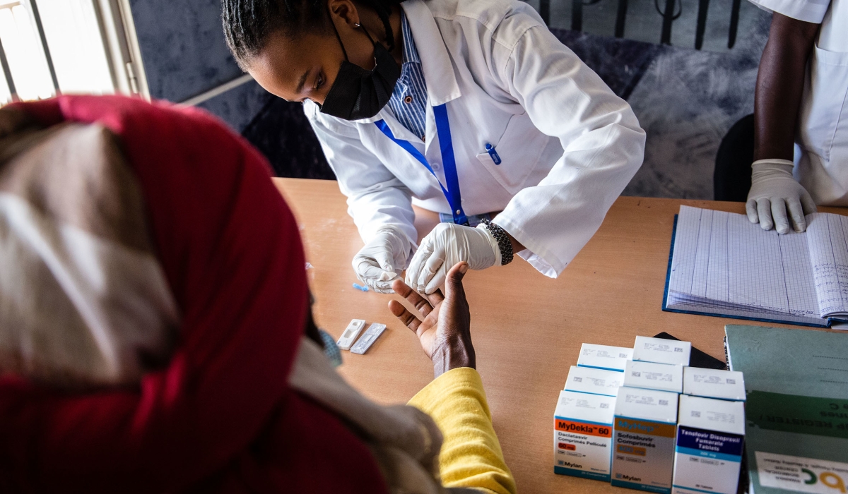 Health workers conduct  Hepatitis test during the celebration of the World Hepatitis Day at Remera health center on July 28, 2021 