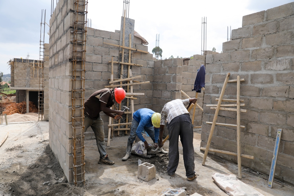 Workers at a construction site in Kigali. Craish Bahizi