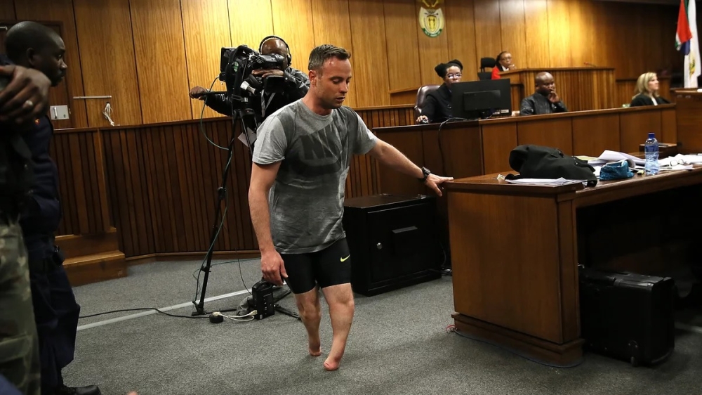 Oscar Pistorius walks without his prosthetic legs during his resentencing hearing at the Pretoria High Court for the 2013 murder of his girlfriend, Reeva Steenkamp (Courtesy photo)