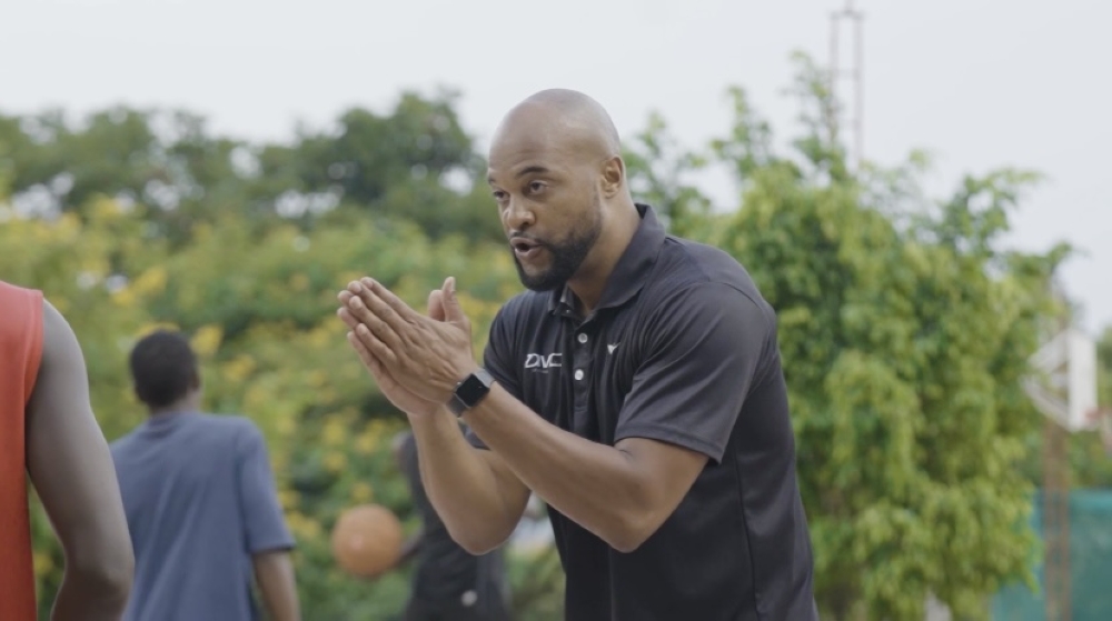 Yusef Aziz, a coach, and former international professional basketball player, gives instructions to his players during a session in Kigali. Courtesy