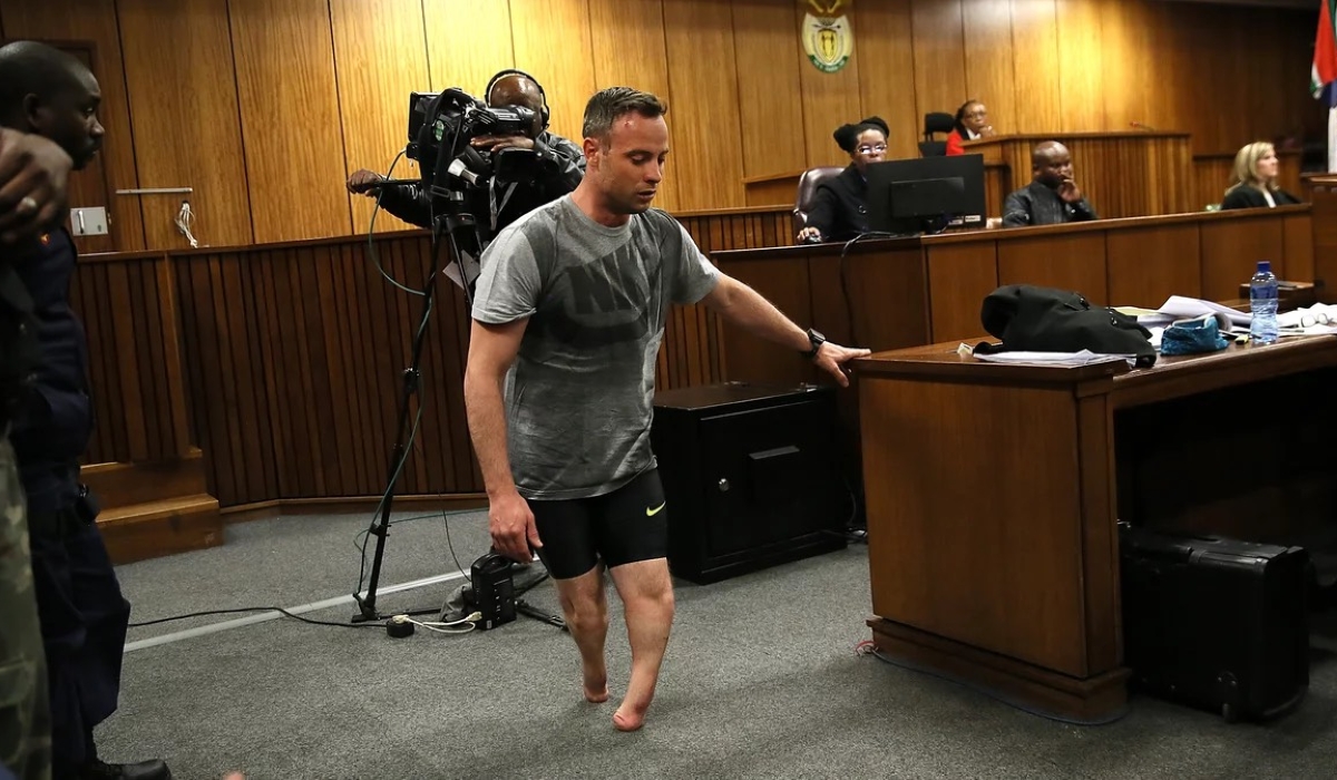 Oscar Pistorius walks without his prosthetic legs during his resentencing hearing at the Pretoria High Court for the 2013 murder of his girlfriend, Reeva Steenkamp (Courtesy photo)