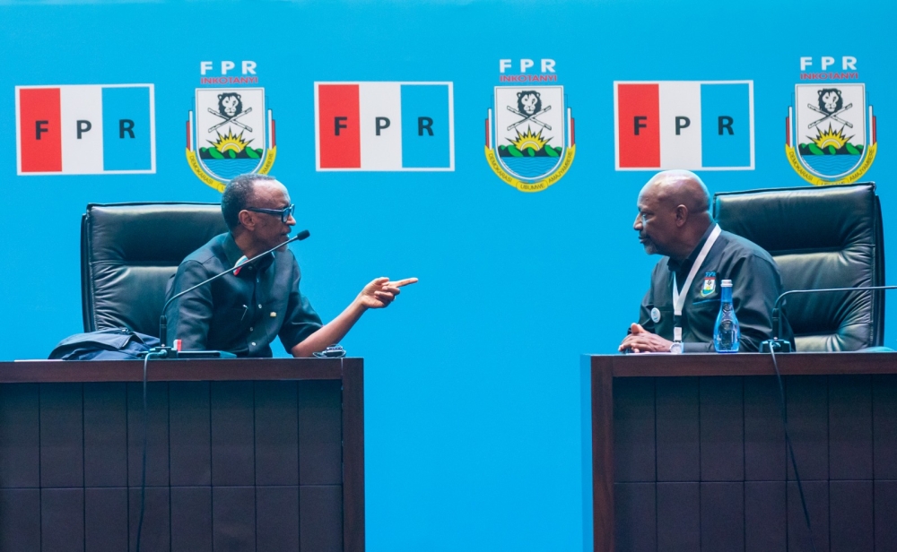 President Paul Kagame, who was re-elected as RPF-Inkotanyi Chairman, chats with Wellars Gasamagera (R), the ruling party&#039;s new Secretary General, during the 16th RPF Congress in Kigali on Sunday, April 2. Olivier Mugwiza