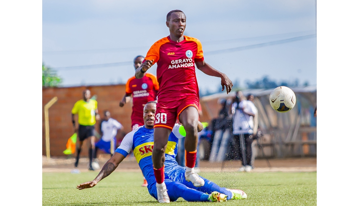 The Blues defender Aboul Rwatubyaye in action as he tries to gain the ball from Police Fc&#039;s player  at Muhanga Stadium on Saturday, April 1. Police FC beat Rayon Sports 4-2. Courtesy 
