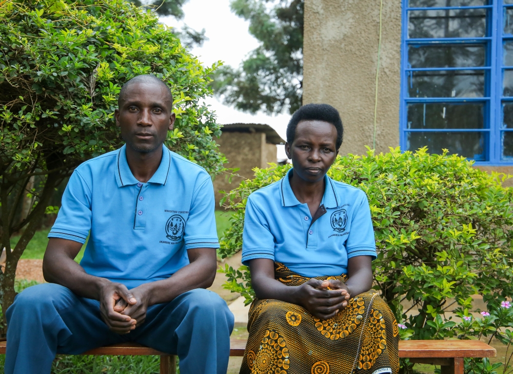 Andre Ahishakiye, a &#039;Binome&#039; community health worker, (right) and Vestine Mukashema, who works as an ASM speak to a journalist at home. Photo by Dan Gatsinzi