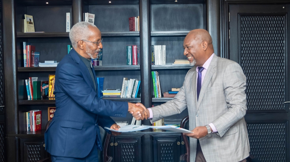 The RPF-Inkotanyi outgoing Secretary General François Ngarambe and the newly elected Secretary General Wellars Gasamagera during the handover ceremony in Kigali on Tuesday, April 4. Courtesy