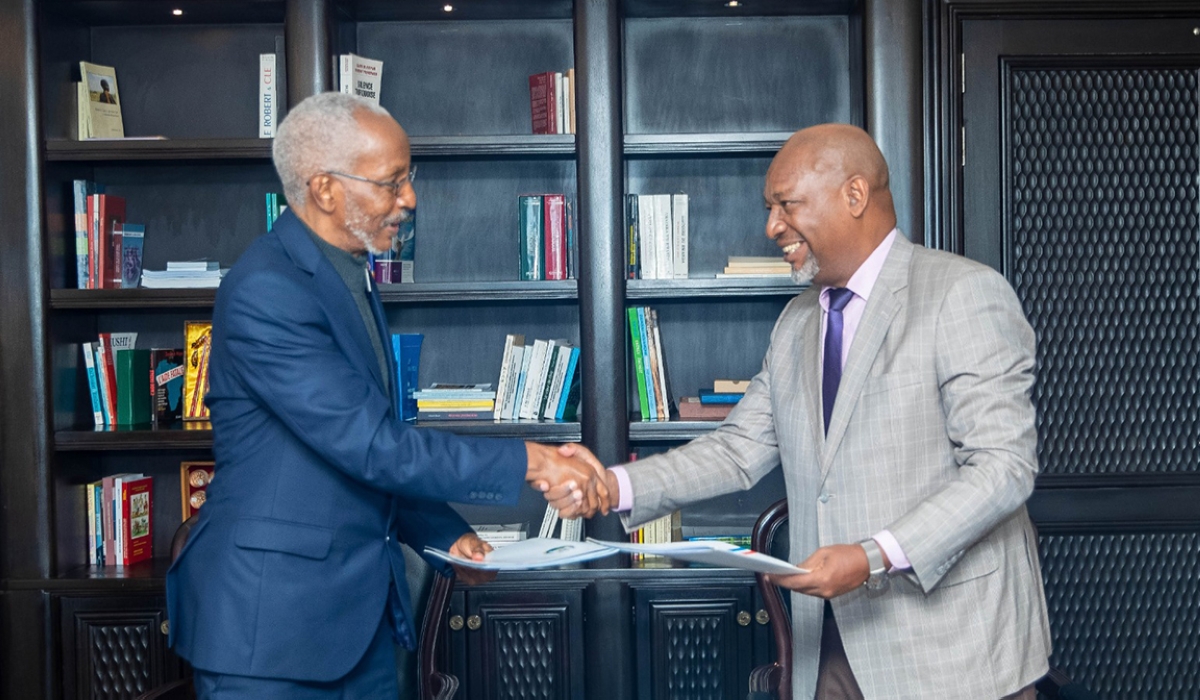 The RPF-Inkotanyi outgoing Secretary General François Ngarambe and the newly elected Secretary General Wellars Gasamagera during the handover ceremony in Kigali on Tuesday, April 4. Courtesy