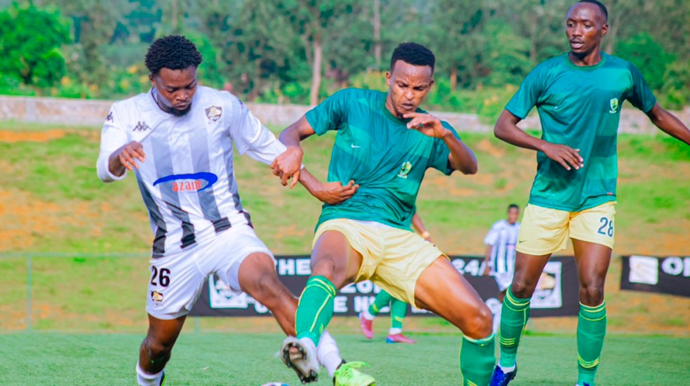 APR FC and Marines FC players battles for the ball during the 2-1 league match at Bugesera Stadium on April 4. Courtesy