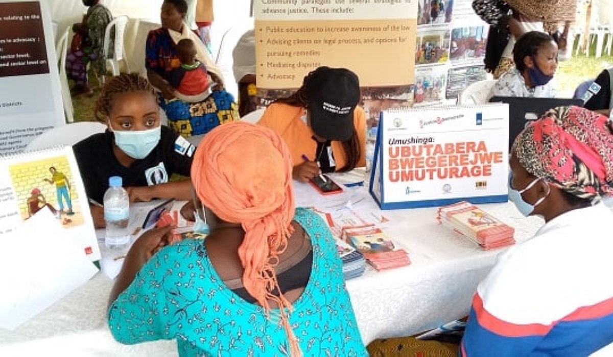 Public Notaries during an outreach program to meet residents for solving some land related issues in Rubavu District.  The revised law will enable notaries to notarize documents remotely, using electronic signatures .