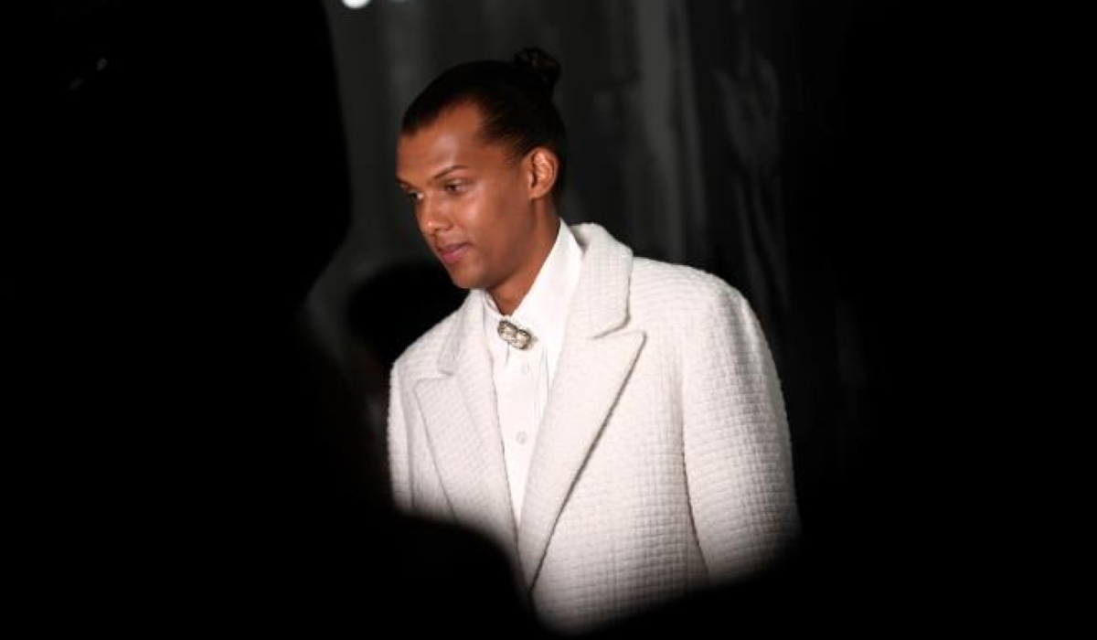 (FILES) In this file photo taken on October 4, 2022 Belgian singer-songwriter Stromae arrives at the Chanel  Spring-Summer 2023 fashion show as part of the Paris Womenswear Fashion Week, in Paris. Belgian singer, composer and producer Paul Van Haver aka Stromae, sick, announced on April 4, 2023, the cancellation of all his concerts until the end of May. (Photo by JULIEN DE ROSA / AFP)