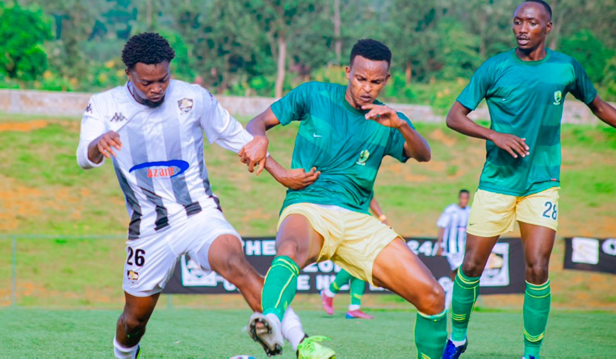 APR FC and Marines FC players battles for the ball during the 2-1 league match at Bugesera Stadium on April 4. Courtesy