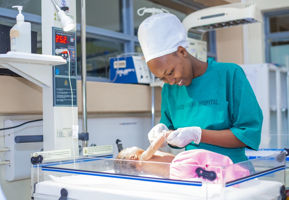 A midwife takes care of a baby at Neonatal care in Kirehe District Hospital. Courtesy