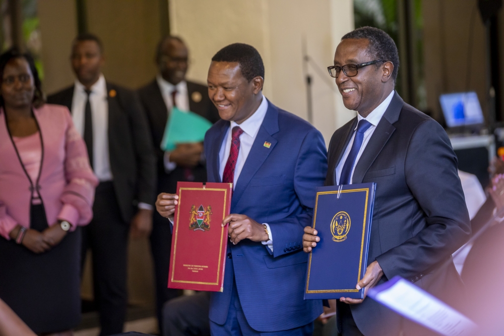 Ministers of Foreign Affairs, Dr Vincent Biruta and his counterpart Alfred Mutua at the signing of the agreement in Kigali, on Tuesday, April 4. Photo by Olivier Mugwiza