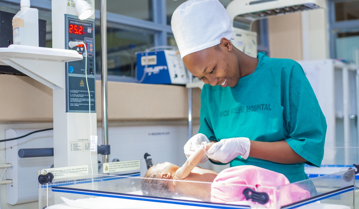 A midwife takes care of a baby at Neonatal care in Kirehe District Hospital. Courtesy