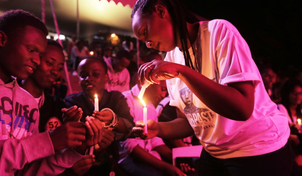 Mourners light candles during a past commemoration event at Kigali Genocide Memorial. Rwandans and friends of Rwanda all over the world will from April 7 to 13, commence the weeklong commemoration of the 1994 Genocide against the Tutsi. Photo by Sam Ngendahimana