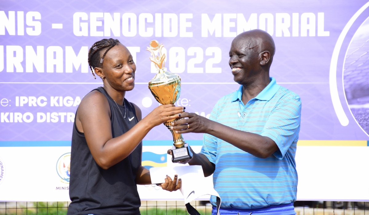 Joselyne Umulisa receives the Women singles trophy from Theoneste Karenzi, the president of Rwanda Tennis Federation on  May 15. The fifth edtion of the tournament will take place from May 1-5 at Kicukiro Ecology Tennis-club. File