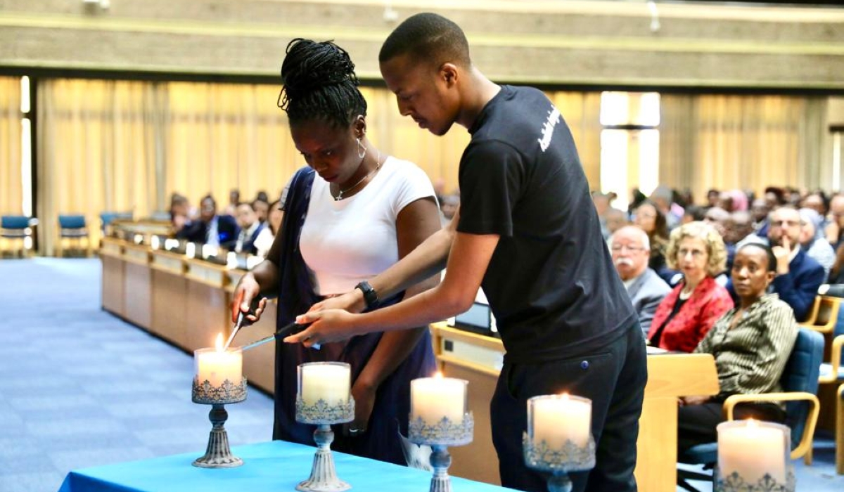 Representatives of the youth lighting candles as a sign of hope after the country&#039;s tragic history.