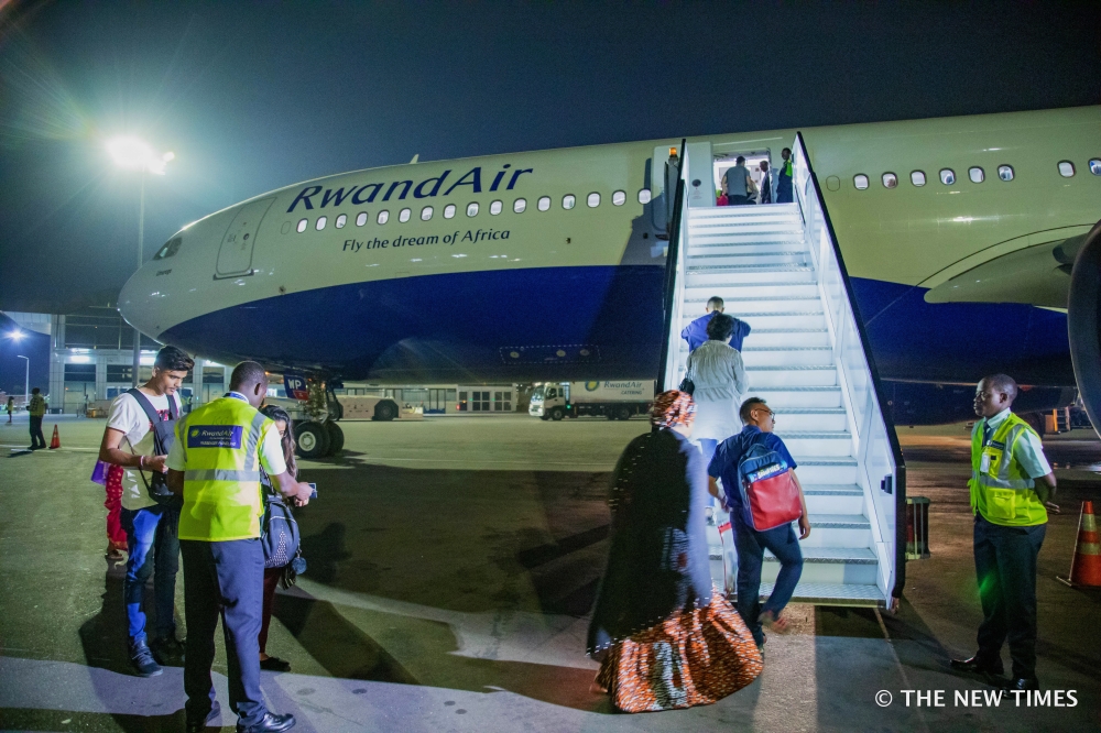 Passengers boarding RwandAir plane at Kigali International Airport in 2020. The airport has been accredited to Level 1 of the Airport Customer Experience Accreditation programme, by the Airports Council International, File