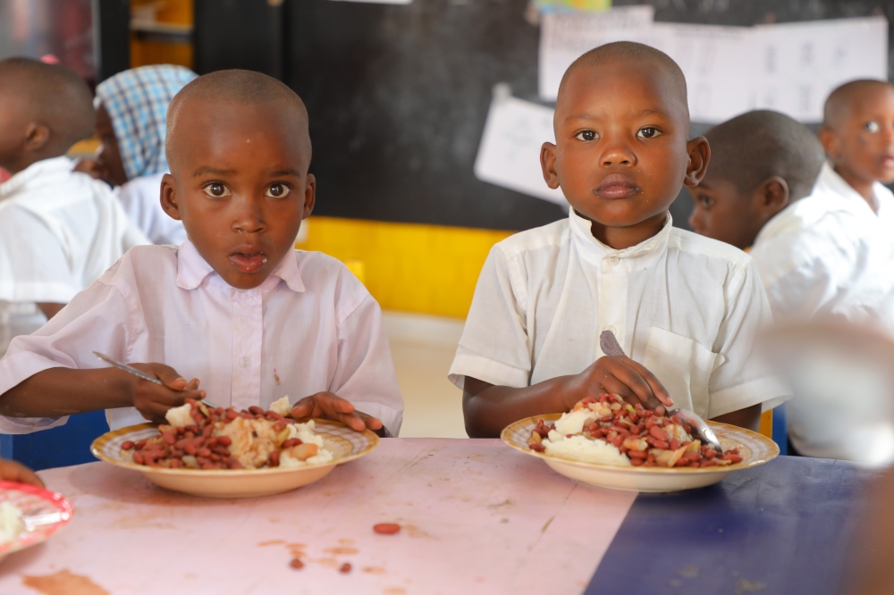 Children having a meal during lunchtime in Kibeho district Photo by Craish Bahizi