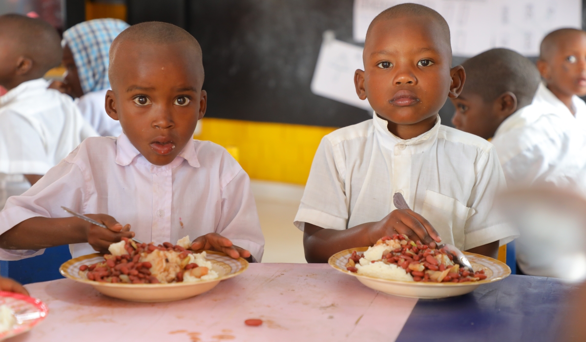 Children having a meal during lunchtime in Kibeho district Photo by Craish Bahizi