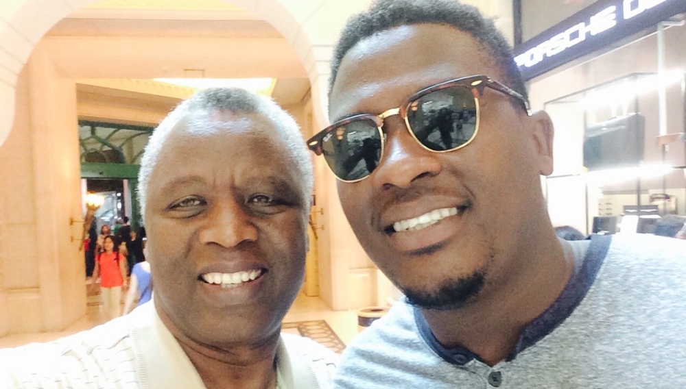 (L-R) Archbishop Mbanda and his son Edwin.Courtesy