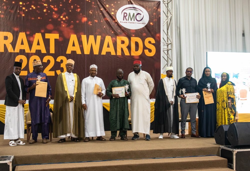 Some of the award winners pose for a group photo with Mufti of Rwanda, Sheikh Salim Hitimana (third left), and The Miraat Awards  Company Ltd chairman Sheik Assouman Habinshuti (first left).