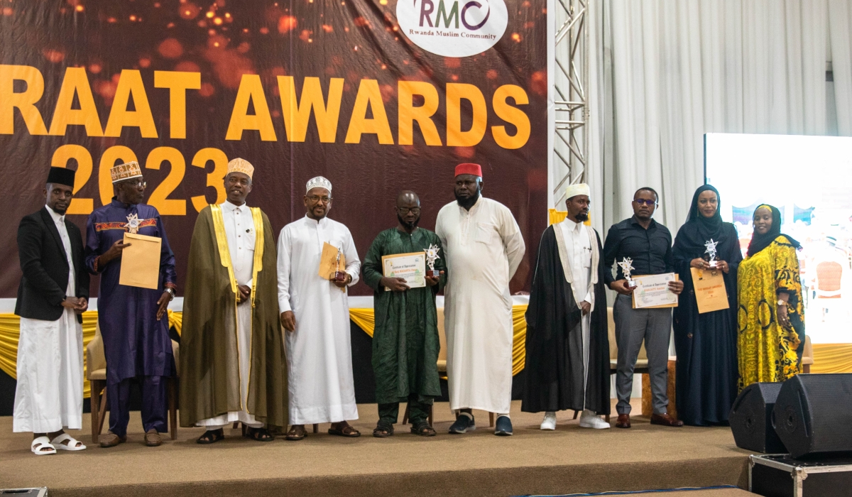 Some of the award winners pose for a group photo with Mufti of Rwanda, Sheikh Salim Hitimana (third left), and The Miraat Awards  Company Ltd chairman Sheik Assouman Habinshuti (first left).
